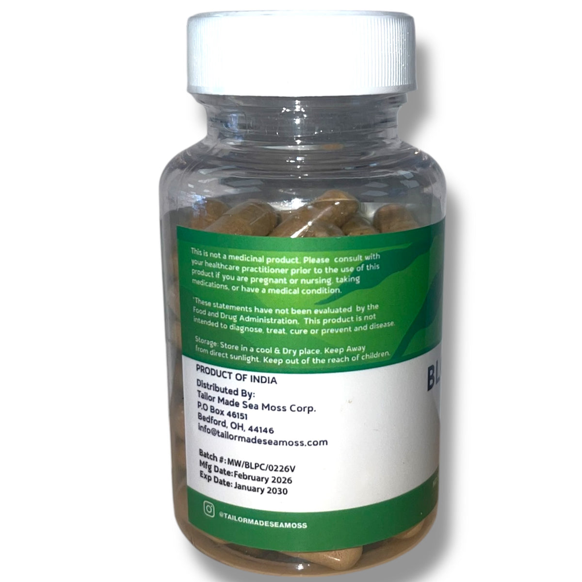 Bottle of pills with a green label on a white background