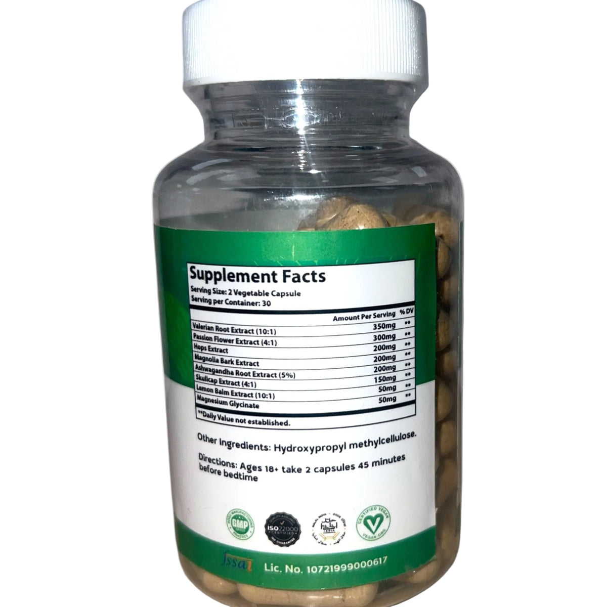 Supplement bottle with green label on a white background