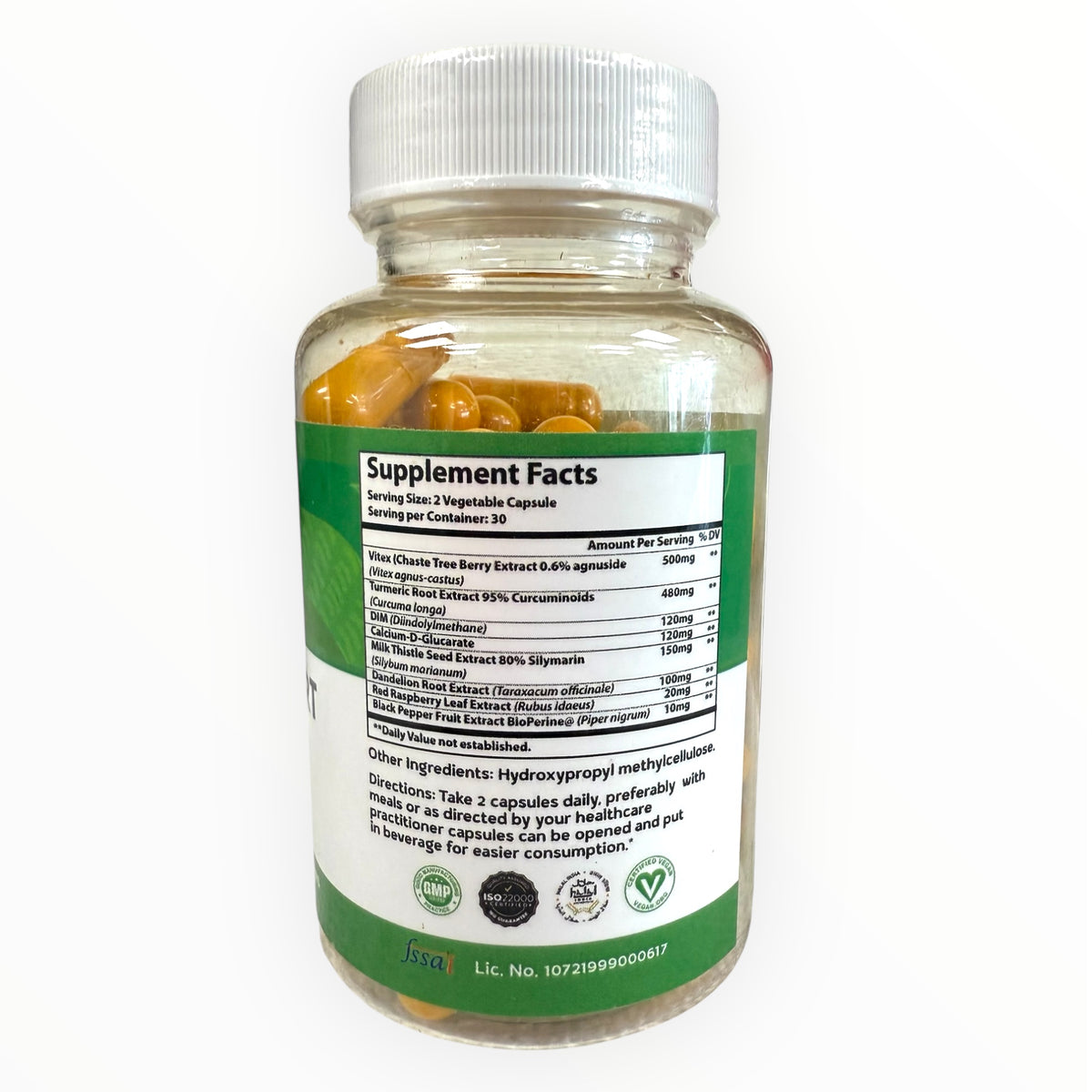 Supplement bottle with a white cap and green label on a white background