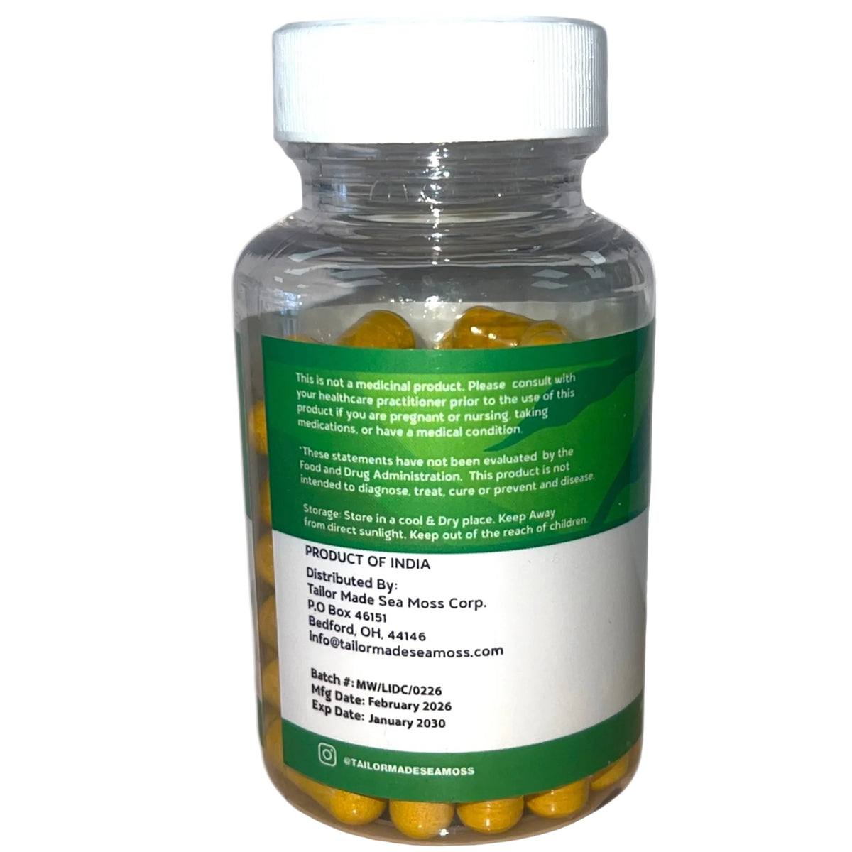 Bottle of yellow capsules with a green label on a white background