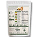 The back of a white stand-up pouch of dietary supplement powder, featuring a detailed green and black label with nutrition facts, ingredients, and usage instructions.