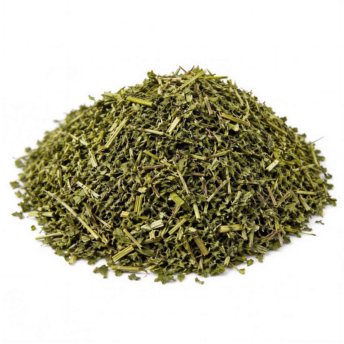A small mound of dried green leafy herb or tea blend on a plain white background.