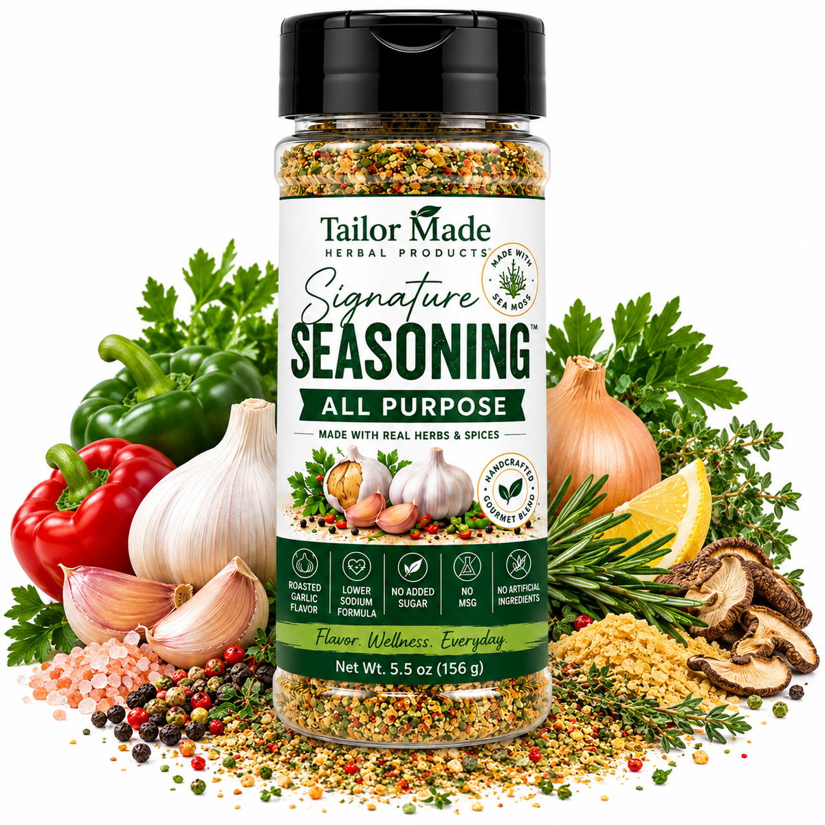 A bottle of Tailor Made Herbal Products Signature Seasoning All Purpose, surrounded by fresh ingredients like garlic, onions, bell peppers, rosemary, mushrooms, and sea salt on a white background.