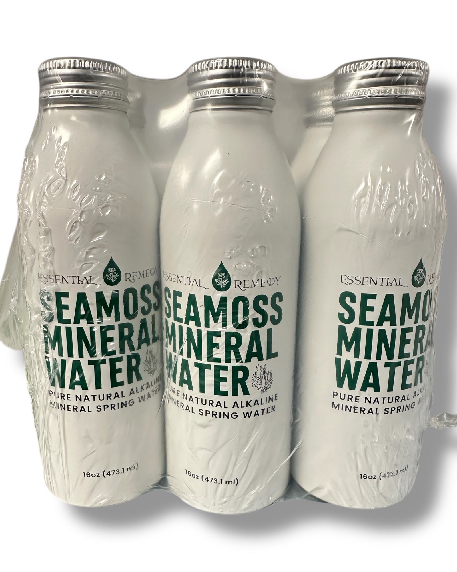 Three bottles of Seamoss Mineral Water in a packaging tray on a white background