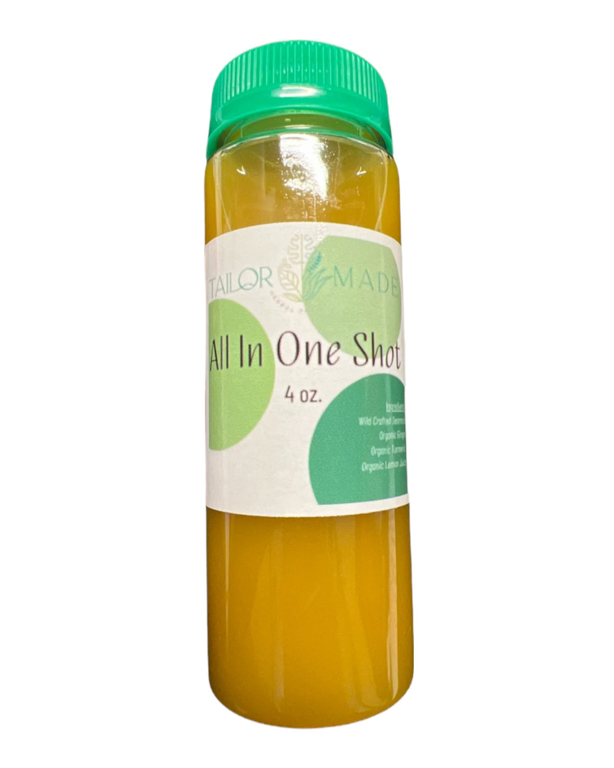 All in one ginger shot with sea moss, turmeric, and lemon on a white clear background